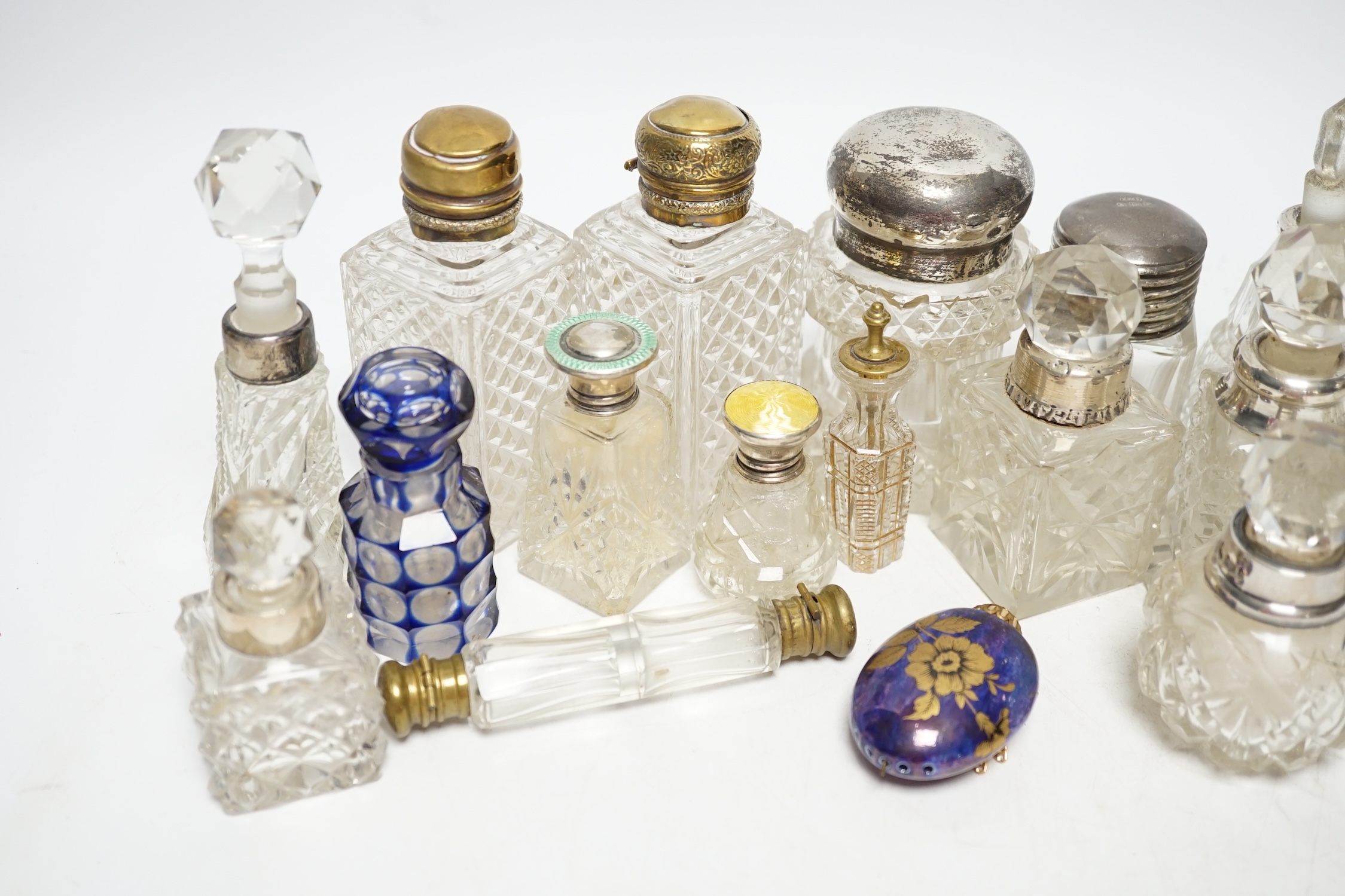 A collection of silver mounted and other perfume bottles